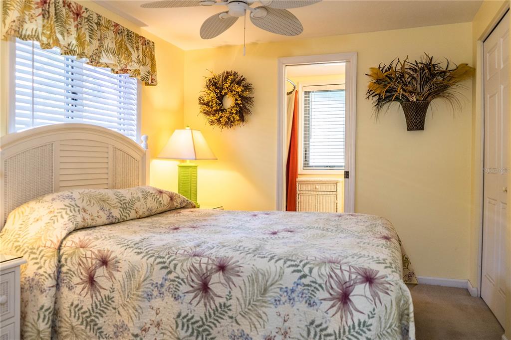 1305 Arbuckle Creek Road Sebring, FL 33870 - Photo 39 of 71 a bedroom with a bed and a chandelier