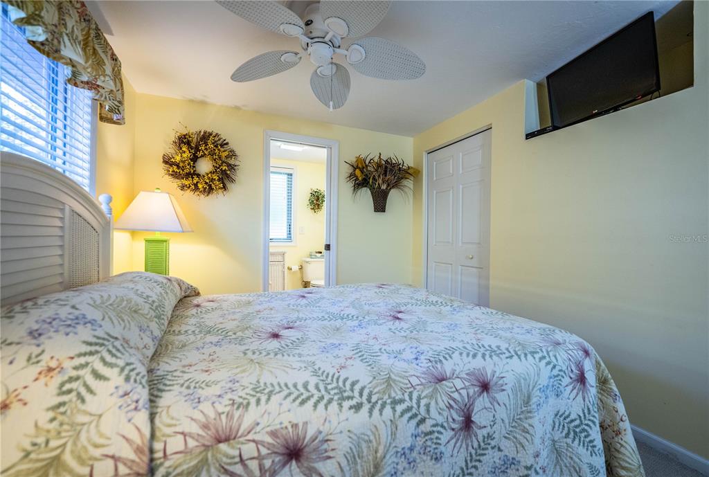 1305 Arbuckle Creek Road Sebring, FL 33870 - Photo 40 of 71 a bedroom with a bed and a chandelier