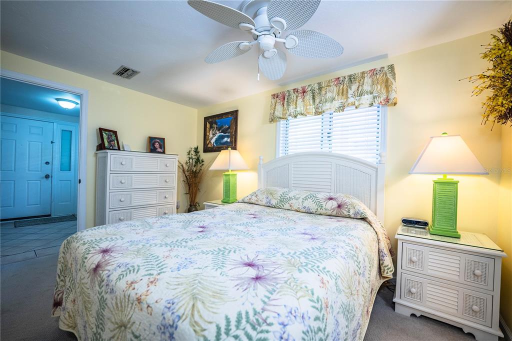 1305 Arbuckle Creek Road Sebring, FL 33870 - Photo 41 of 71 a bedroom with a bed and a dresser