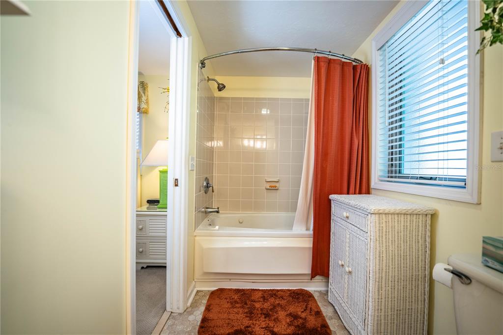 1305 Arbuckle Creek Road Sebring, FL 33870 - Photo 43 of 71 a bathroom with a bathtub and a shower