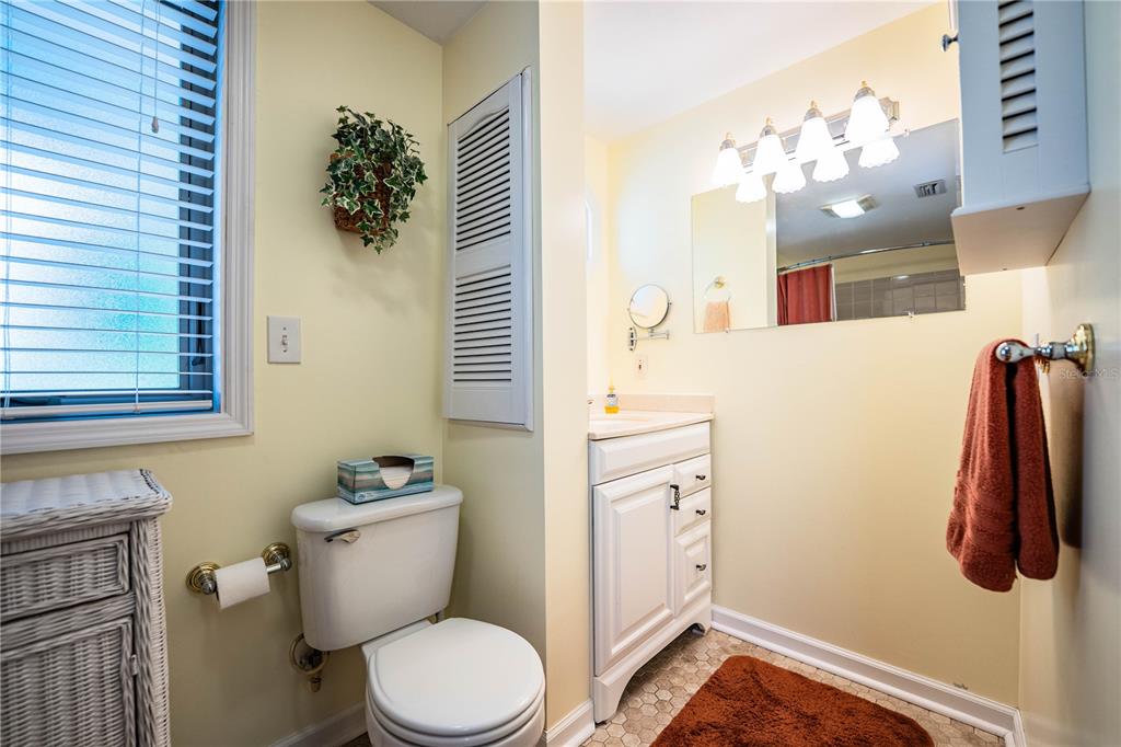 1305 Arbuckle Creek Road Sebring, FL 33870 - Photo 44 of 71 a bathroom with a sink a toilet and shower curtain