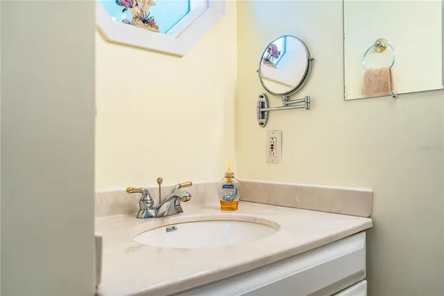 an aerial view of a house with a ocean view