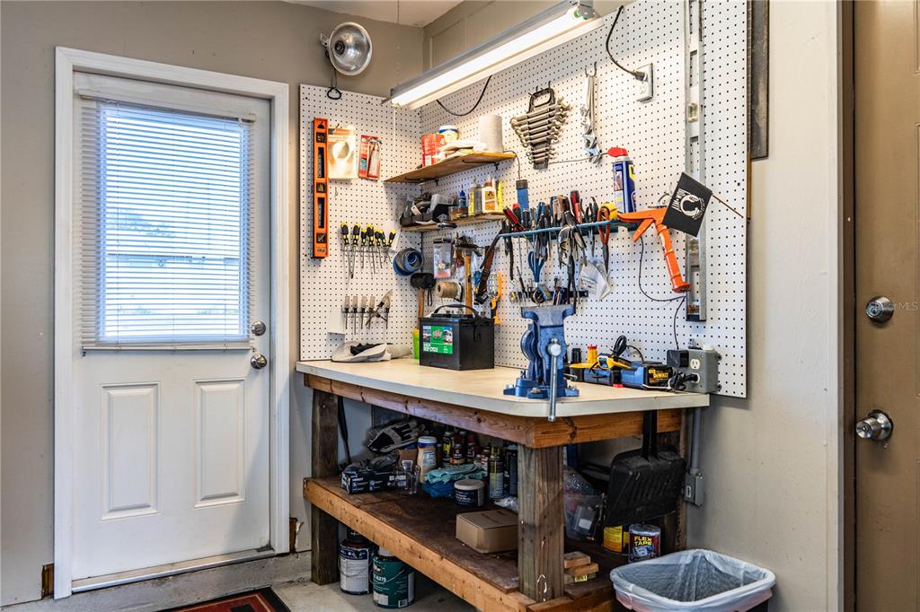 1305 Arbuckle Creek Road Sebring, FL 33870 - Photo 48 of 71 a room with lots of bottles of alcohol