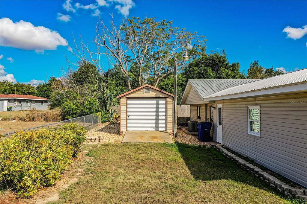 1305 Arbuckle Creek Road Sebring, FL 33870 - Photo 56 of 71 a view of a house with a yard