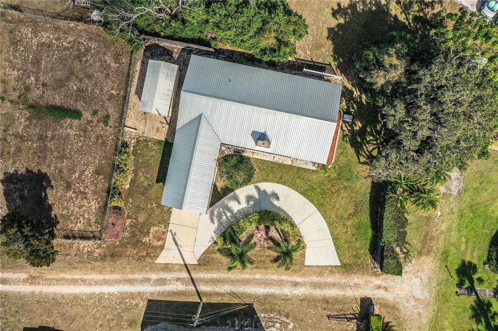 1305 Arbuckle Creek Road Sebring, FL 33870 - Photo 64 of 71 an aerial view of a house with a yard