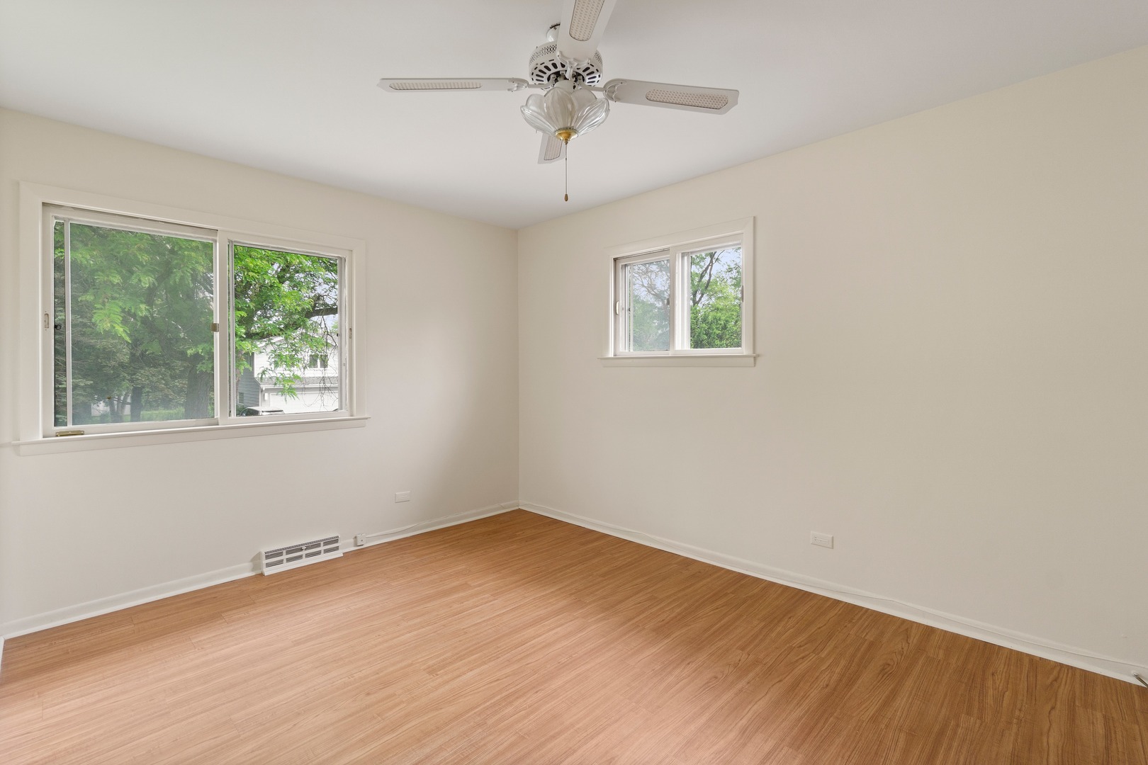 49 Mulberry Road Deerfield, IL 60015 - Photo 12 of 17 a view of an empty room with wooden floor and a window