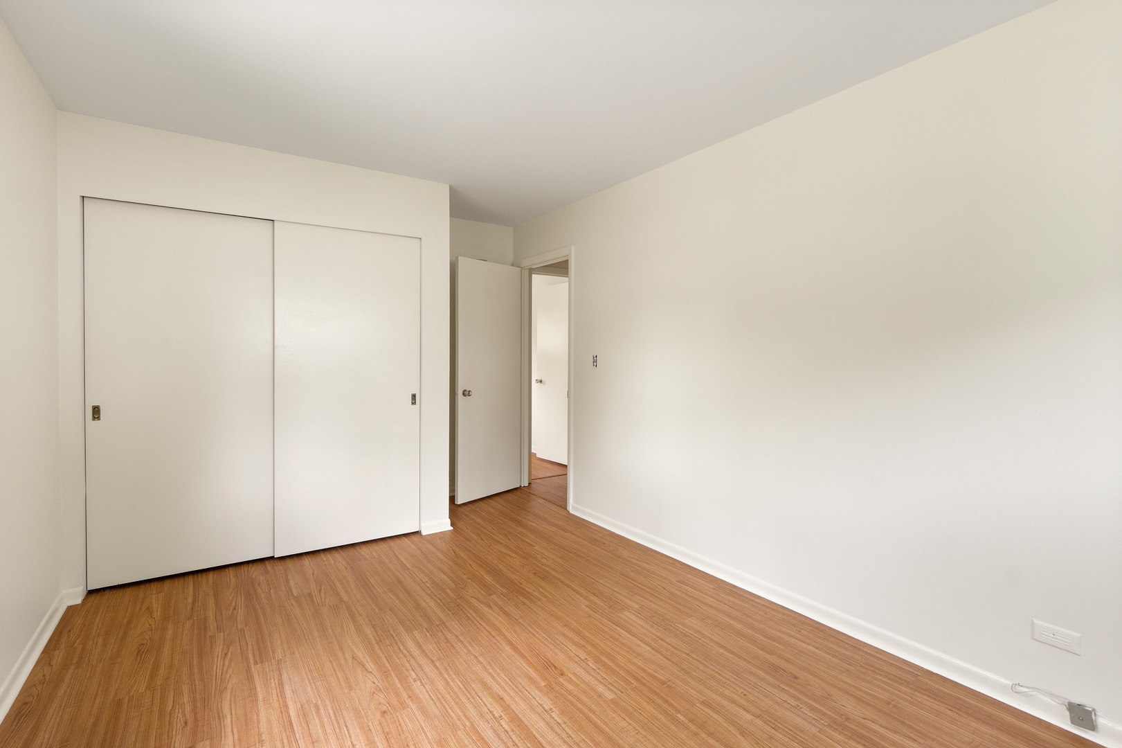 49 Mulberry Road Deerfield, IL 60015 - Photo 13 of 17 a view of an empty room with wooden floor