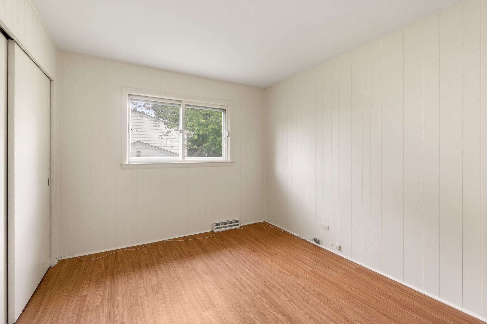 49 Mulberry Road Deerfield, IL 60015 - Photo 15 of 17 an empty room with wooden floor and windows