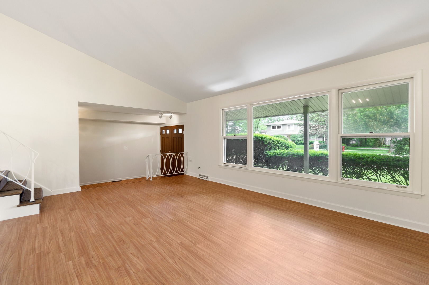 49 Mulberry Road Deerfield, IL 60015 - Photo 5 of 17 an empty room with wooden floor and windows