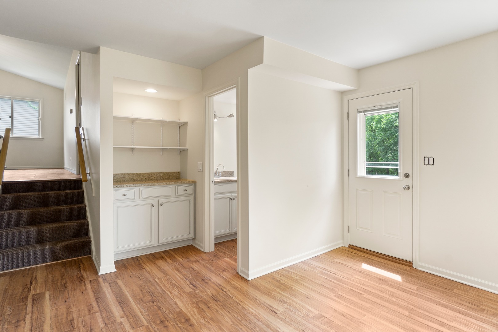 49 Mulberry Road Deerfield, IL 60015 - Photo 9 of 17 a view of a kitchen with wooden floor and electronic appliances