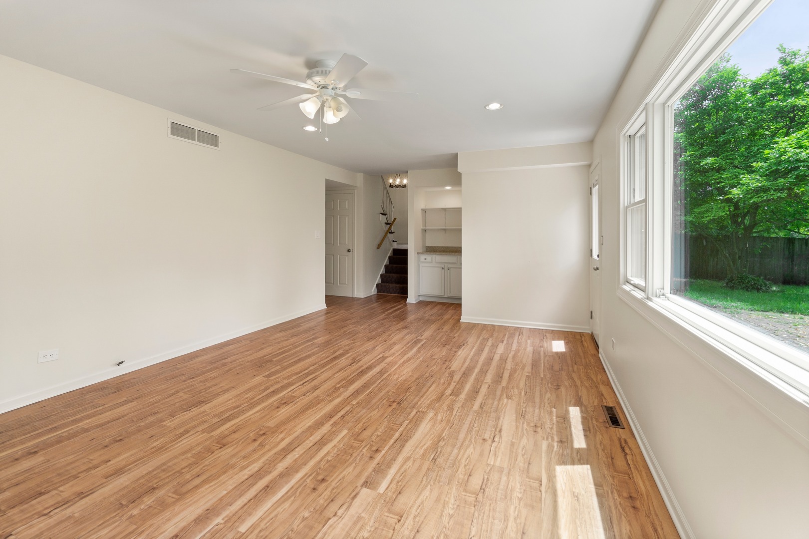 49 Mulberry Road Deerfield, IL 60015 - Photo 10 of 17 wooden floor in an empty room with a window