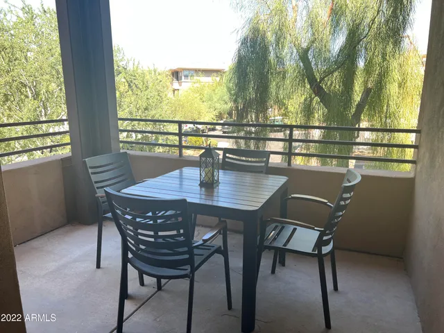 a view of a dining room with furniture and window