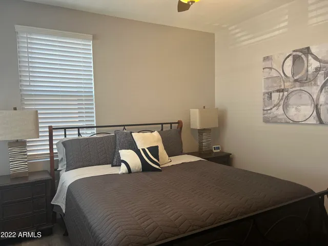 a bedroom with a bed and window