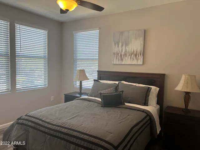 a bedroom with bed and window