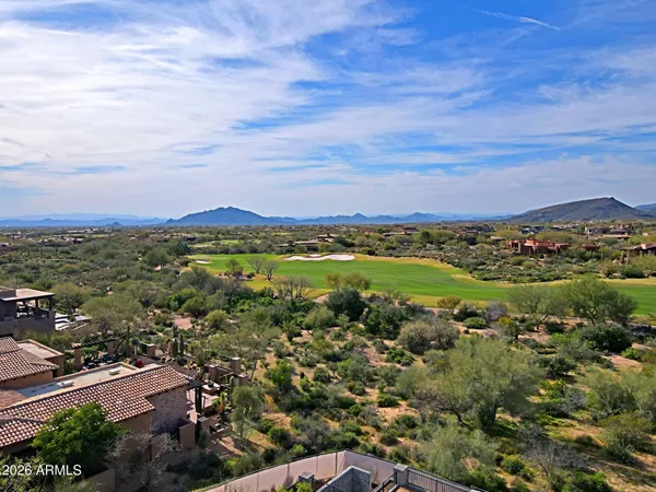 an aerial view of a city and mountain view in back
