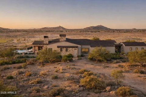 an aerial view of houses with a lake