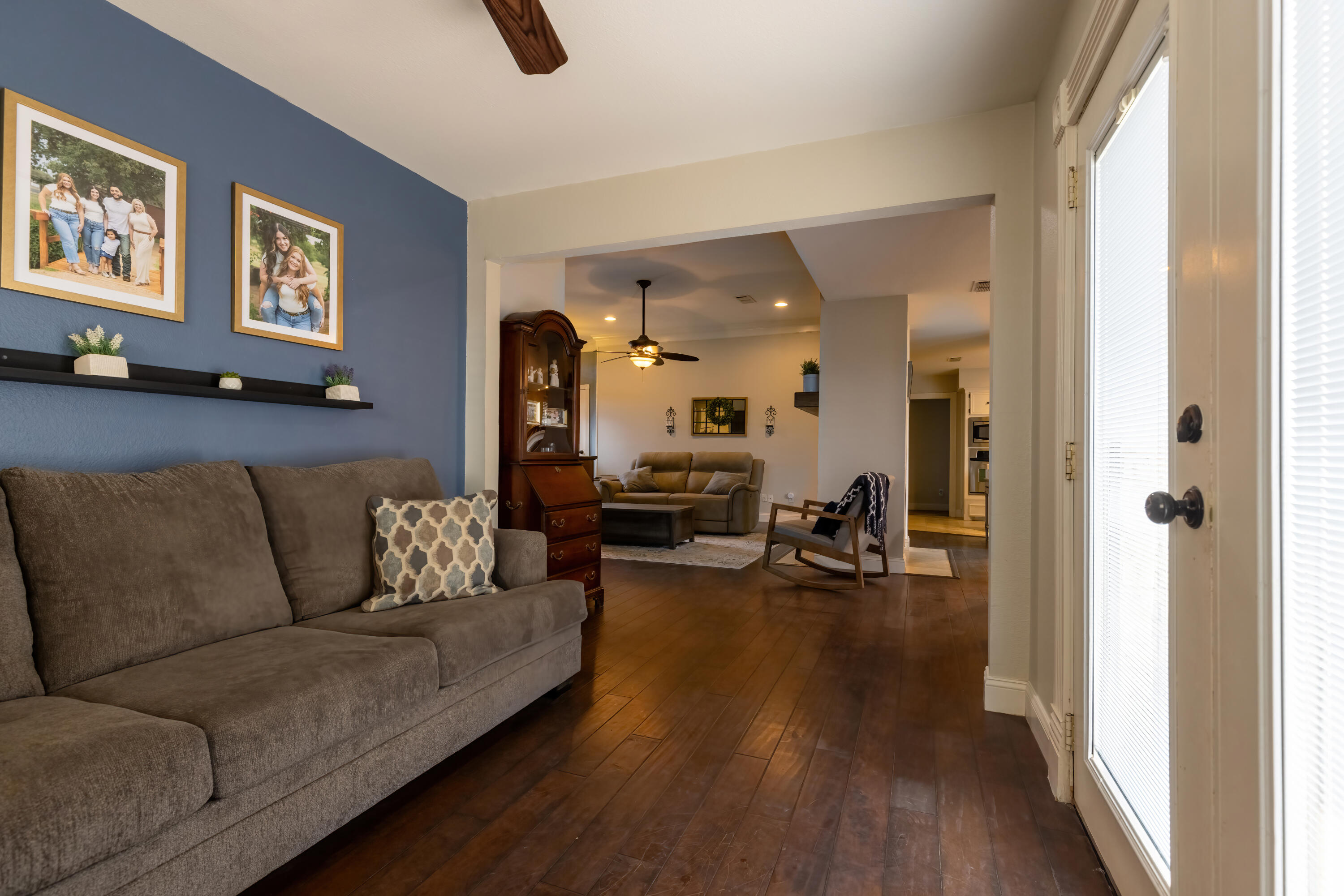7807 Homestead Avenue Lubbock, TX 79424 - Photo 12 of 31 a living room with furniture and a wooden floor