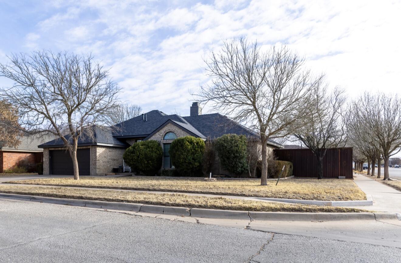7807 Homestead Avenue Lubbock, TX 79424 - Photo 2 of 31 a view of a house with a yard