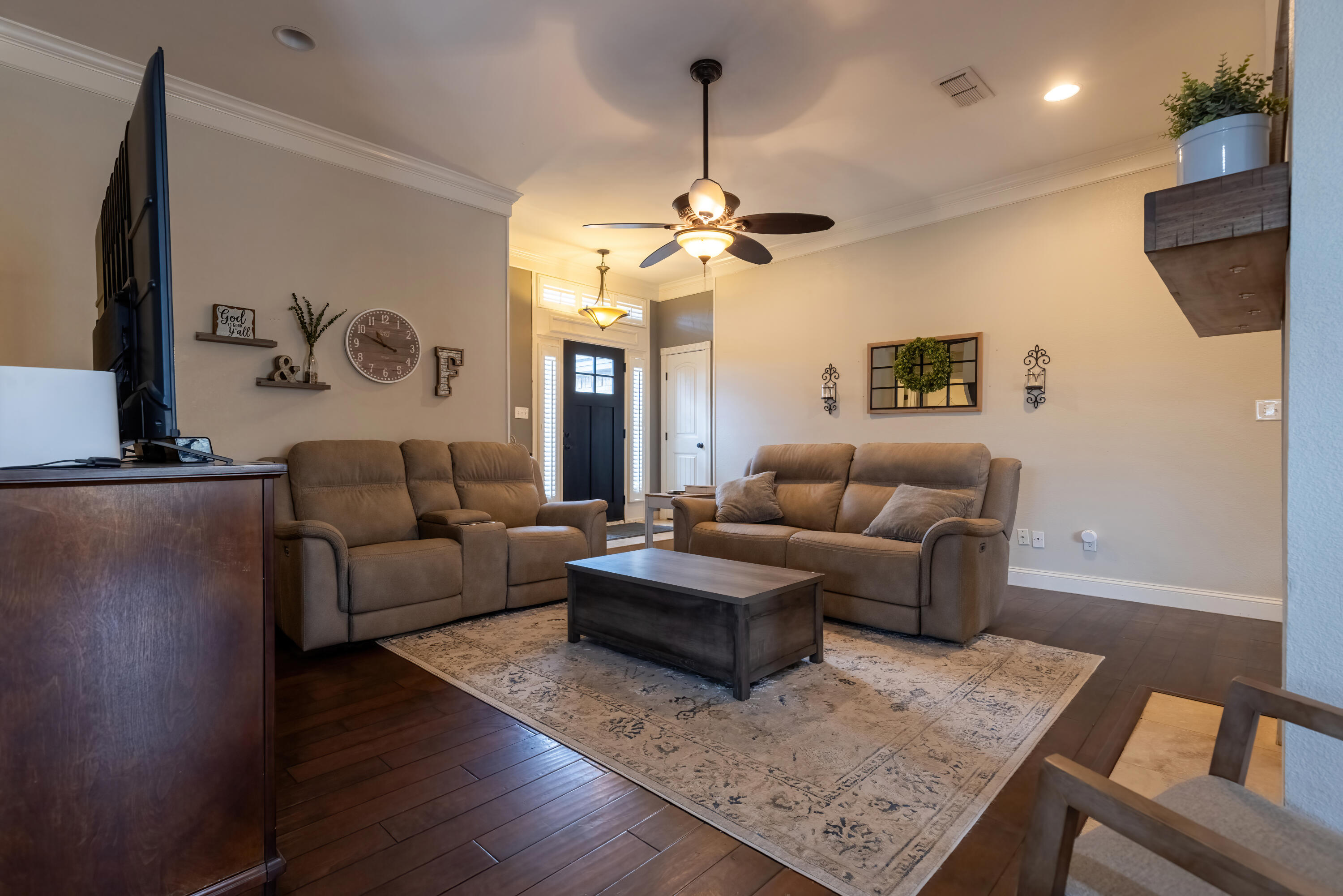 7807 Homestead Avenue Lubbock, TX 79424 - Photo 6 of 31 a living room with furniture and a chandelier