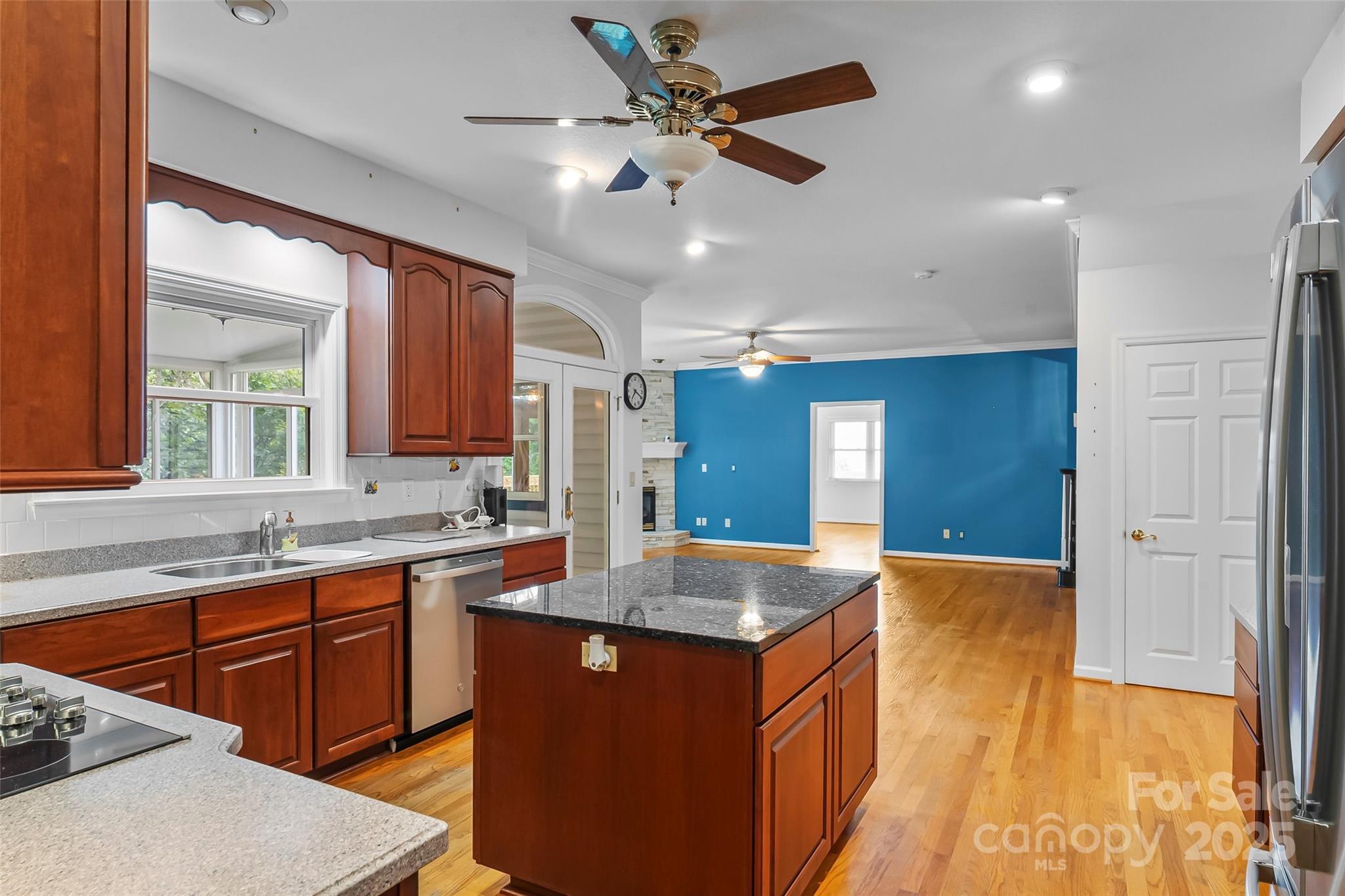 506 Kings Ridge Asheville, NC 28804 - Photo 13 of 44 a kitchen with stainless steel appliances granite countertop a sink a stove and a refrigerator