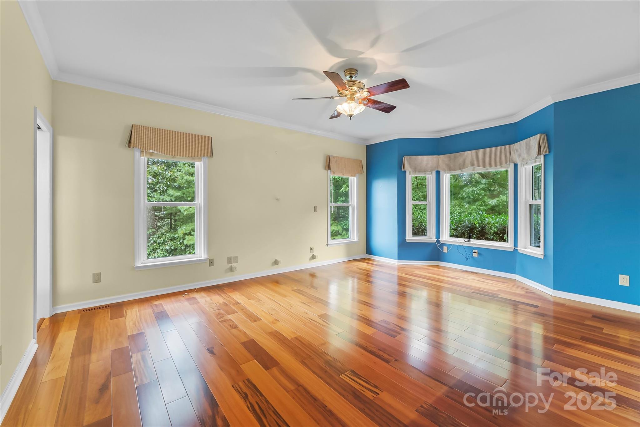 506 Kings Ridge Asheville, NC 28804 - Photo 15 of 44 a view of an empty room with wooden floor and a window