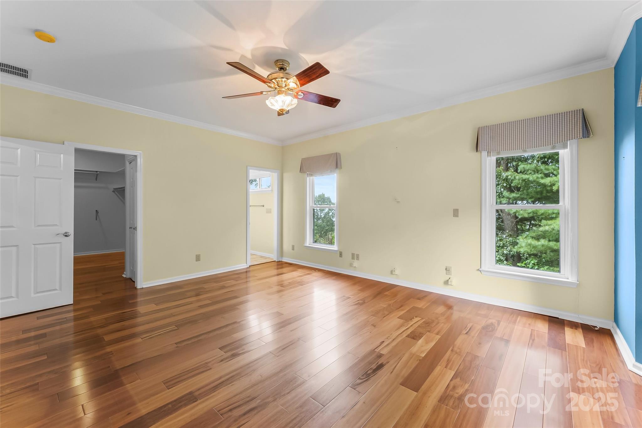 506 Kings Ridge Asheville, NC 28804 - Photo 17 of 44 a view of an empty room with wooden floor and a window
