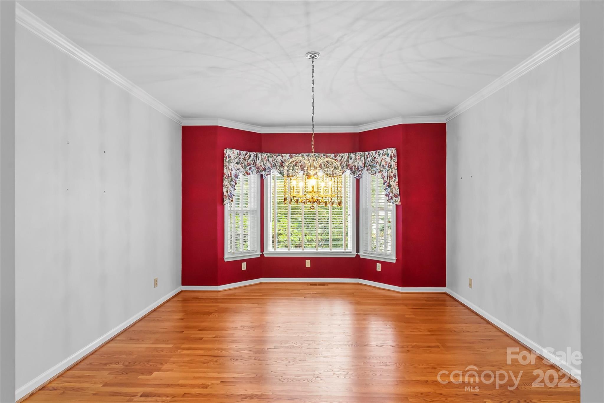 506 Kings Ridge Asheville, NC 28804 - Photo 22 of 44 a view of a room with window wooden floor and chandelier