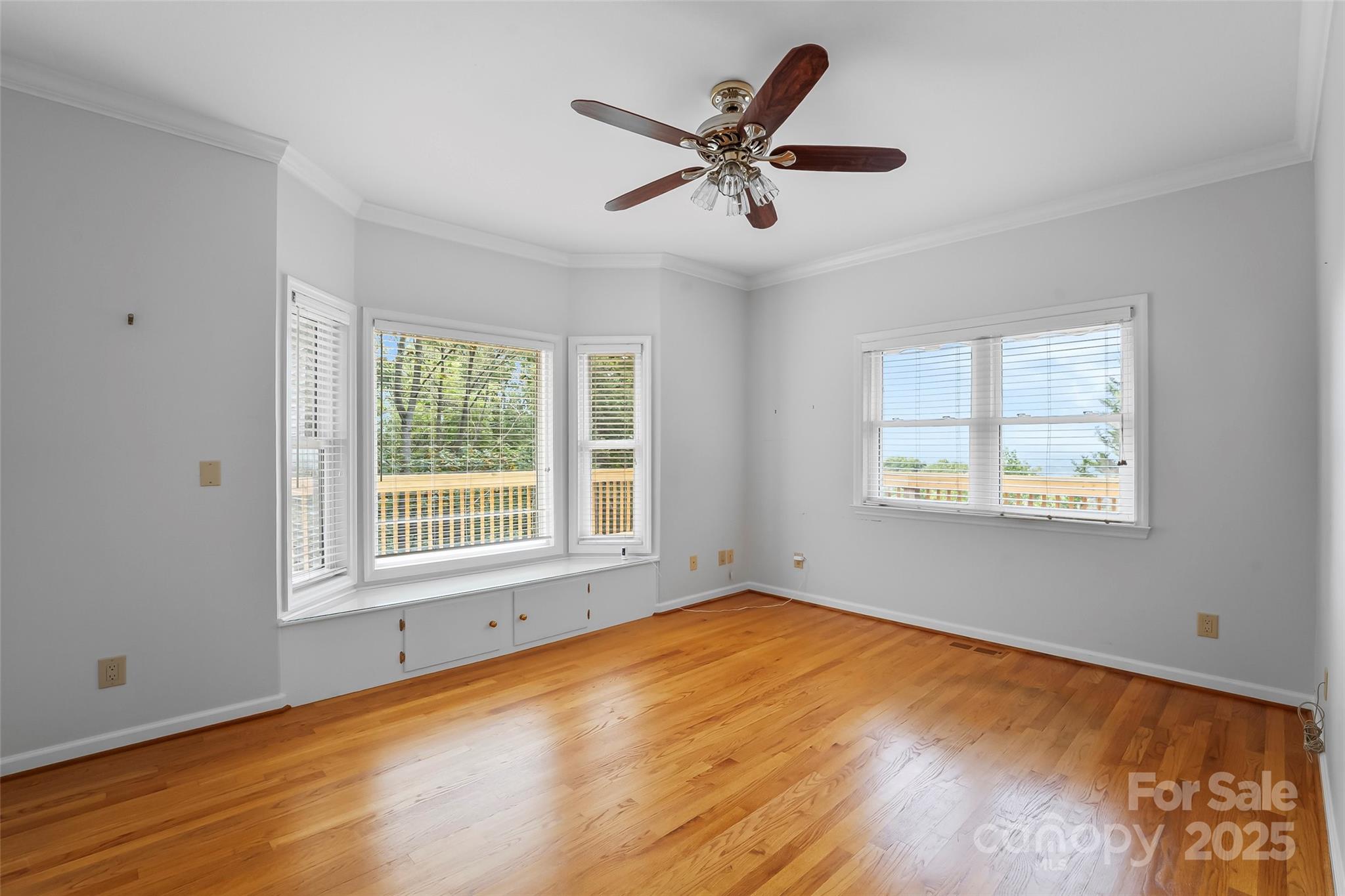 506 Kings Ridge Asheville, NC 28804 - Photo 23 of 44 a view of a big room with wooden floor and windows