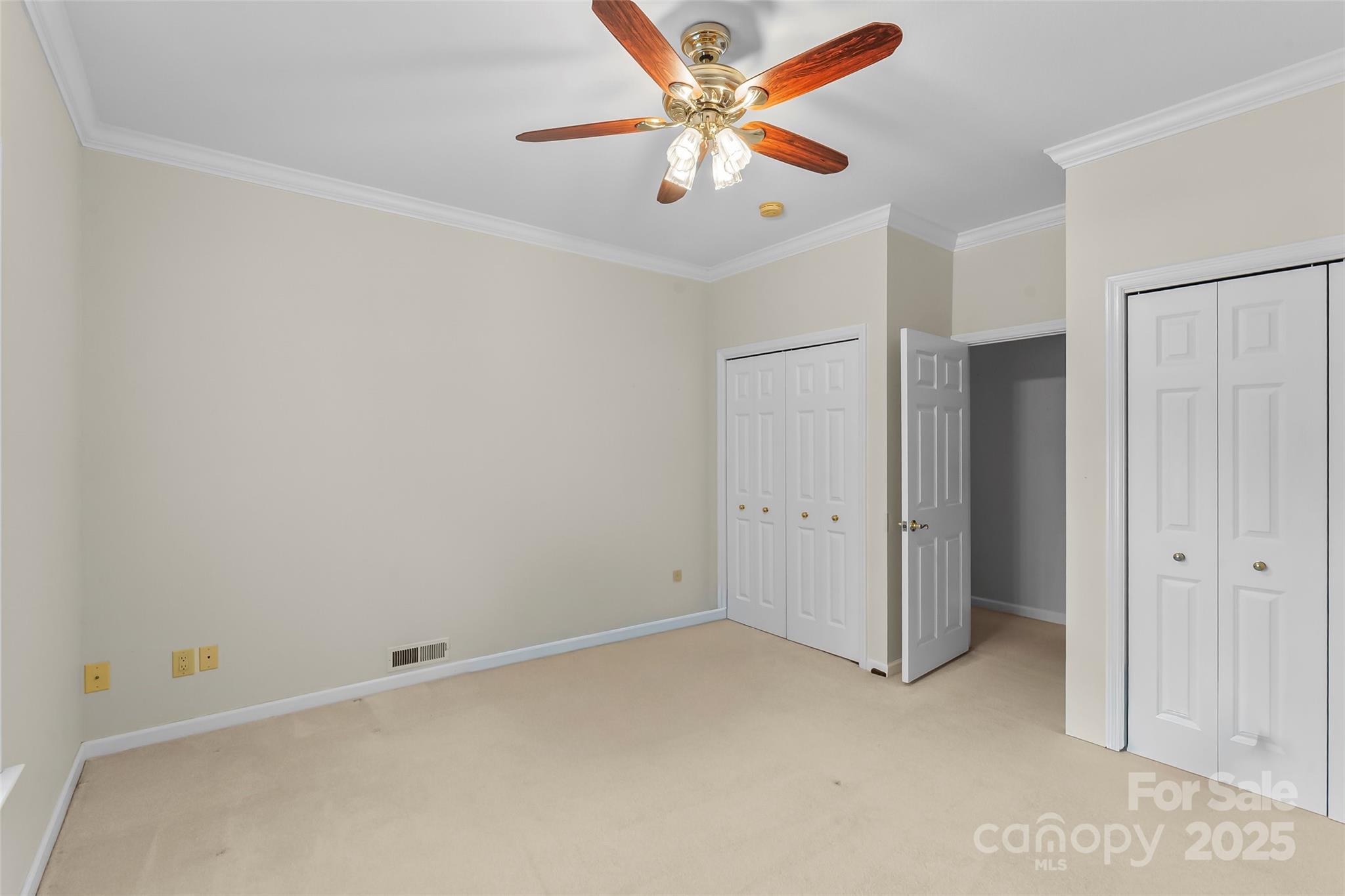 506 Kings Ridge Asheville, NC 28804 - Photo 25 of 44 an empty room with closet and a ceiling fan