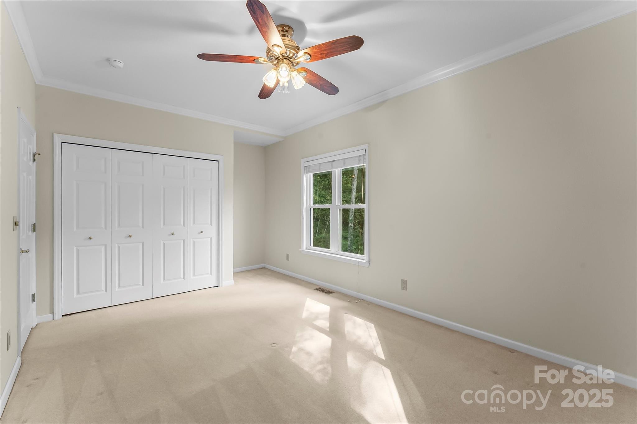 506 Kings Ridge Asheville, NC 28804 - Photo 26 of 44 an empty room with chandelier fan and windows