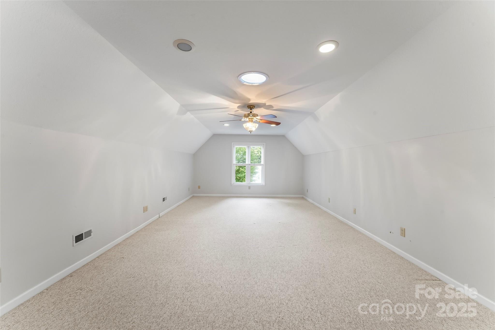 506 Kings Ridge Asheville, NC 28804 - Photo 27 of 44 an empty room with a ceiling fan and window