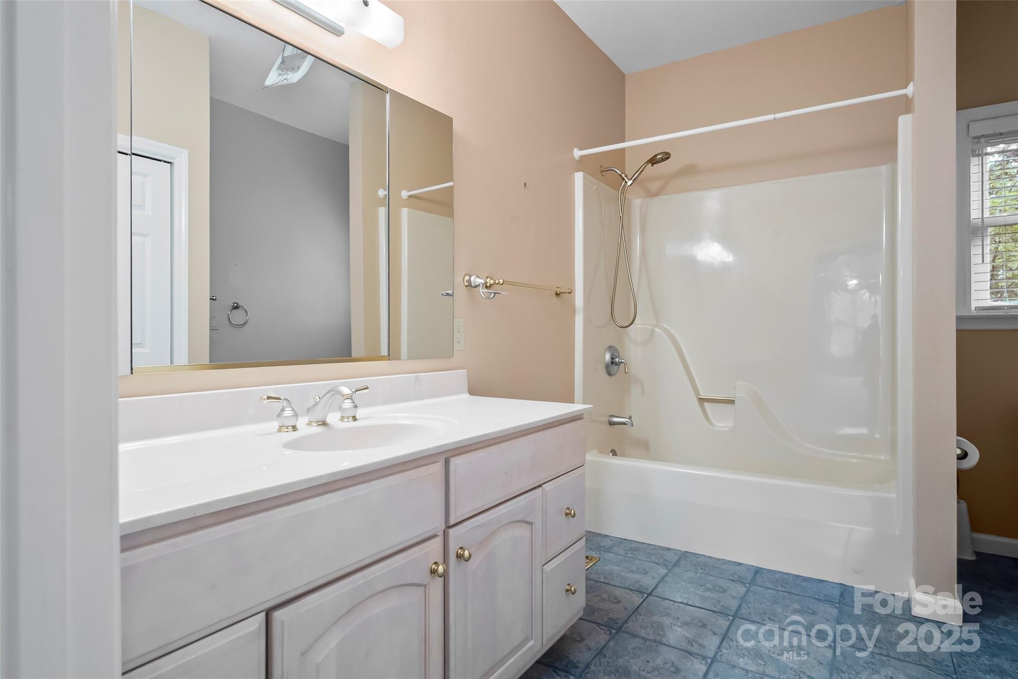 506 Kings Ridge Asheville, NC 28804 - Photo 28 of 44 a bathroom with a shower sink and mirror
