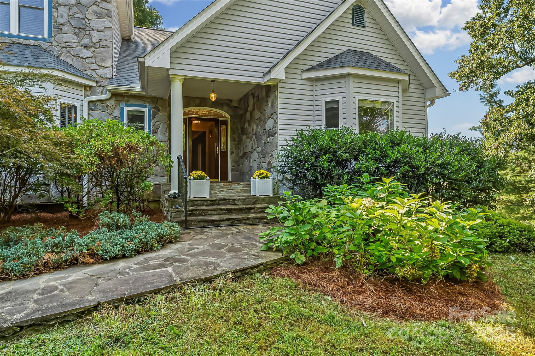506 Kings Ridge Asheville, NC 28804 - Photo 3 of 44 a front view of a house with garden