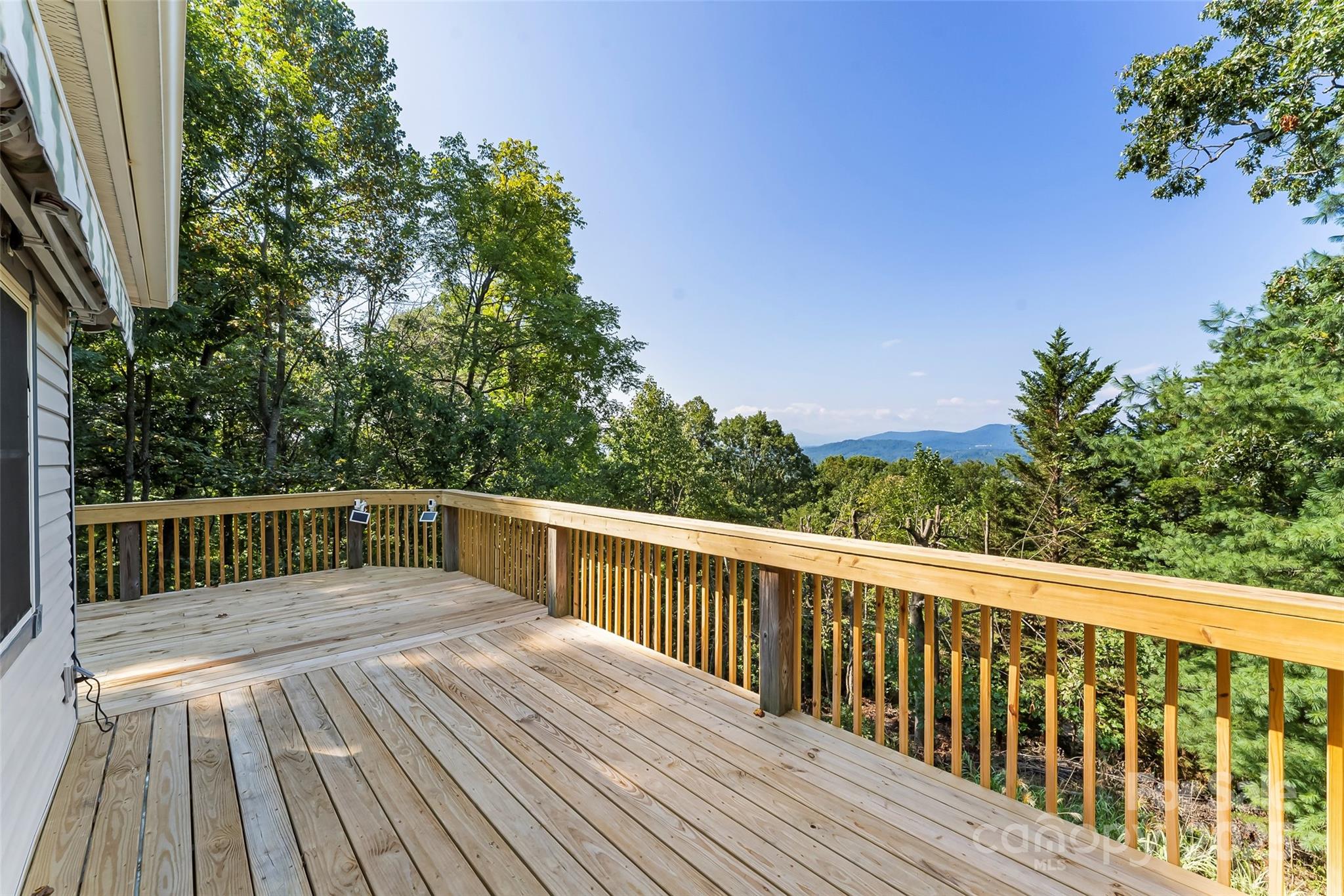 506 Kings Ridge Asheville, NC 28804 - Photo 37 of 44 a view of balcony with wooden floor and fence