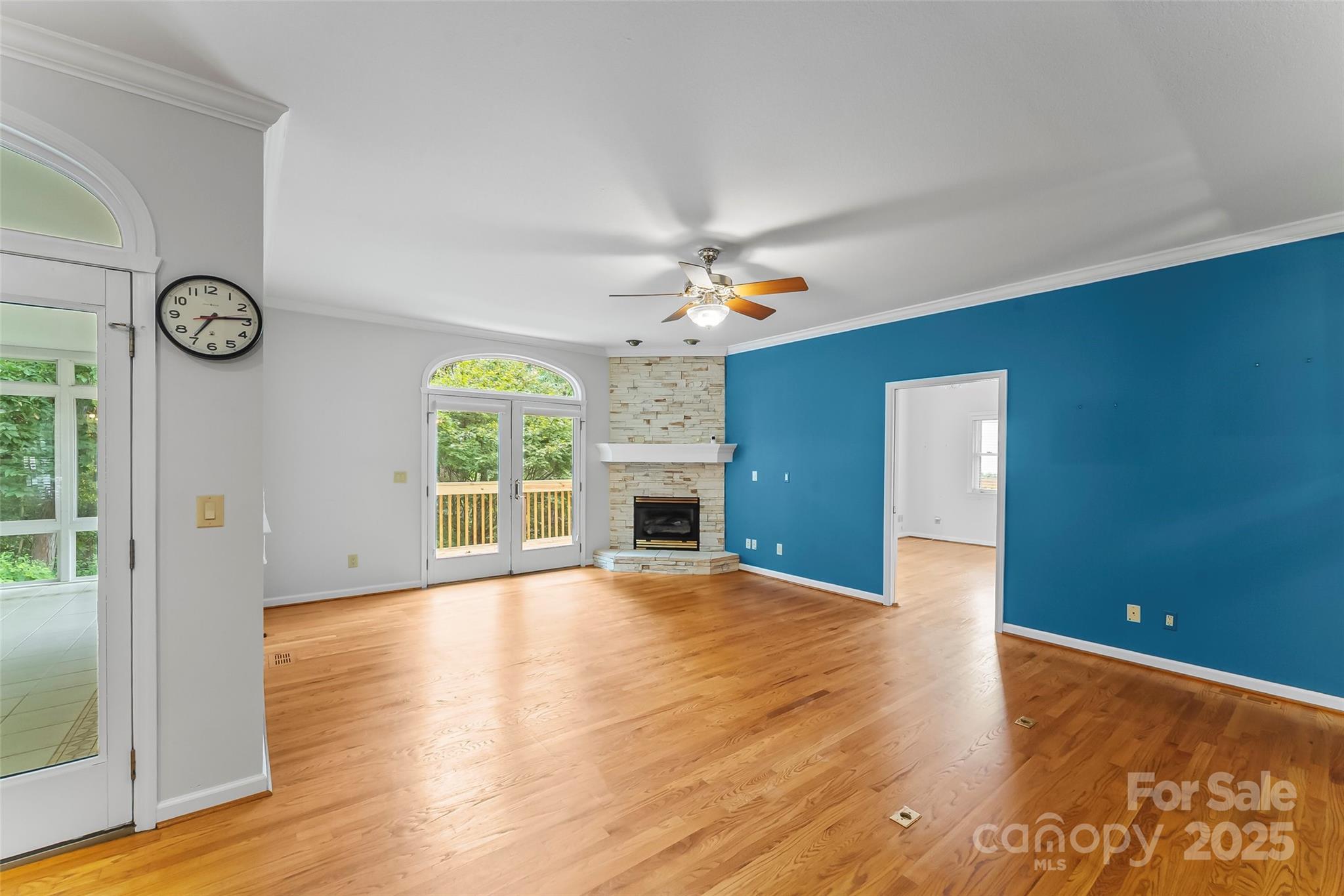 506 Kings Ridge Asheville, NC 28804 - Photo 8 of 44 a view of an empty room with window and wooden floor