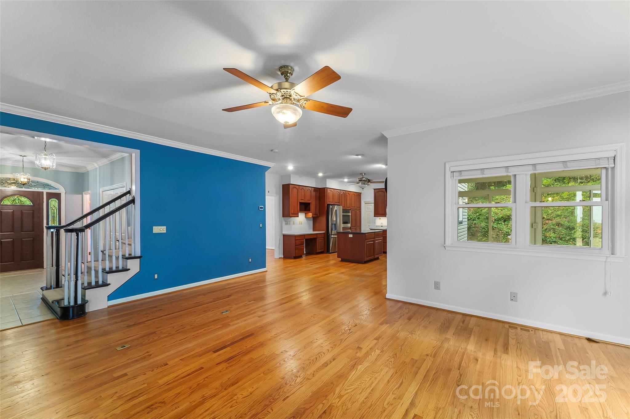 506 Kings Ridge Asheville, NC 28804 - Photo 9 of 44 a view of a livingroom with wooden floor and a ceiling fan