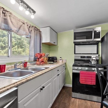 289 Brookside Road Athol, MA 01331 - Photo 3 of 22 a kitchen with stainless steel appliances granite countertop a sink stove and cabinets