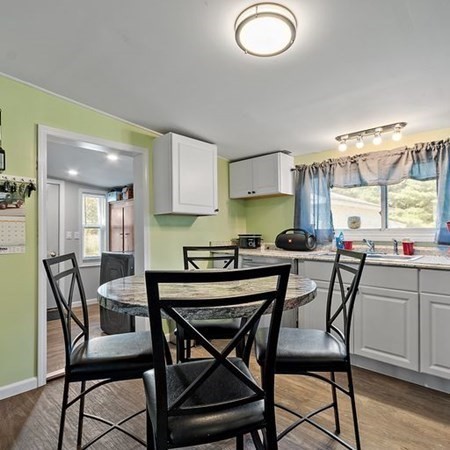 289 Brookside Road Athol, MA 01331 - Photo 5 of 22 a dining room with a wooden table and chairs