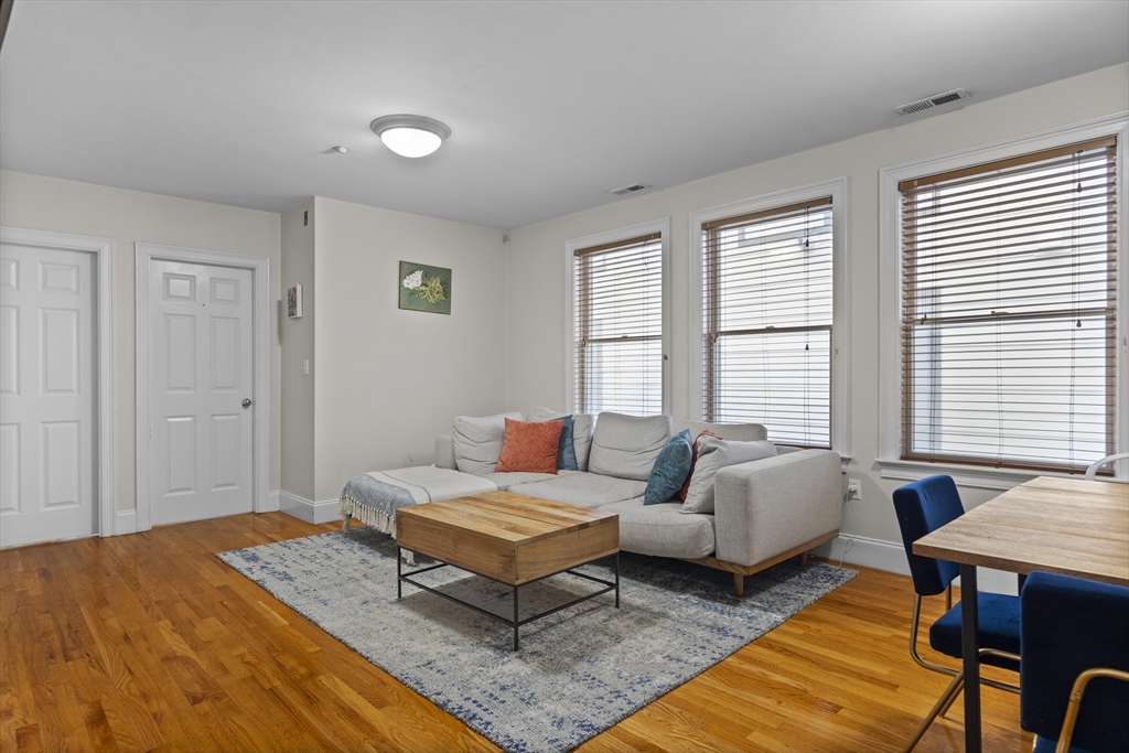 320 West Broadway, Unit 6 Boston, MA 02127 - Photo 4 of 14 a living room with furniture and a window
