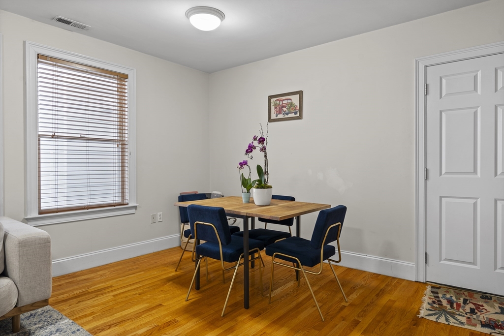 320 West Broadway, Unit 6 Boston, MA 02127 - Photo 5 of 14 a view of a dining room with furniture and wooden floor