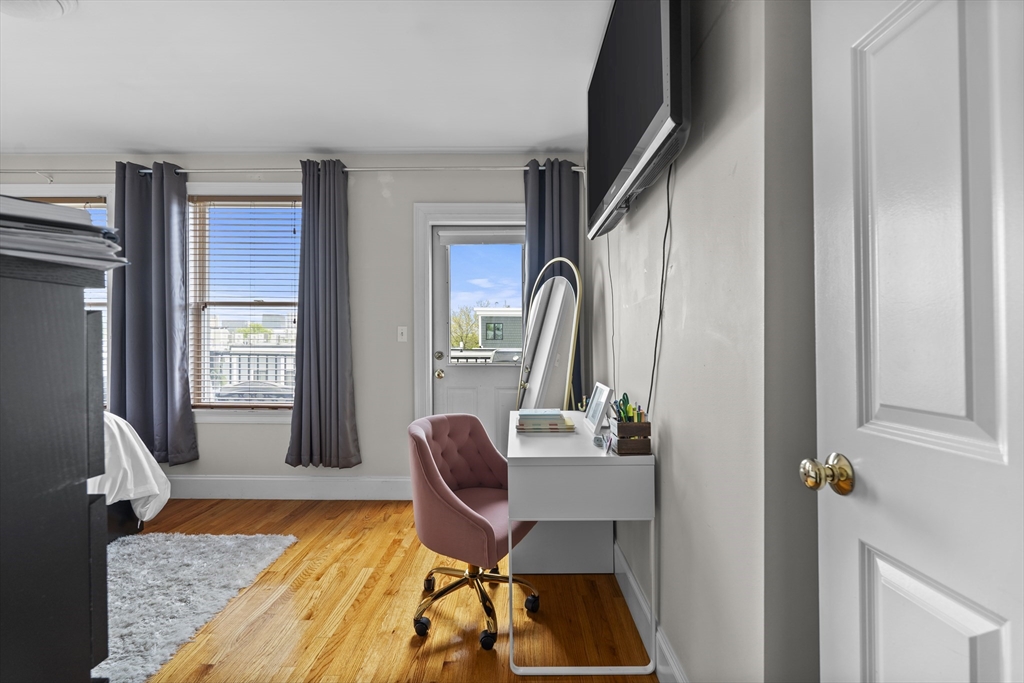 320 West Broadway, Unit 6 Boston, MA 02127 - Photo 8 of 14 a view of a workspace with furniture and a window