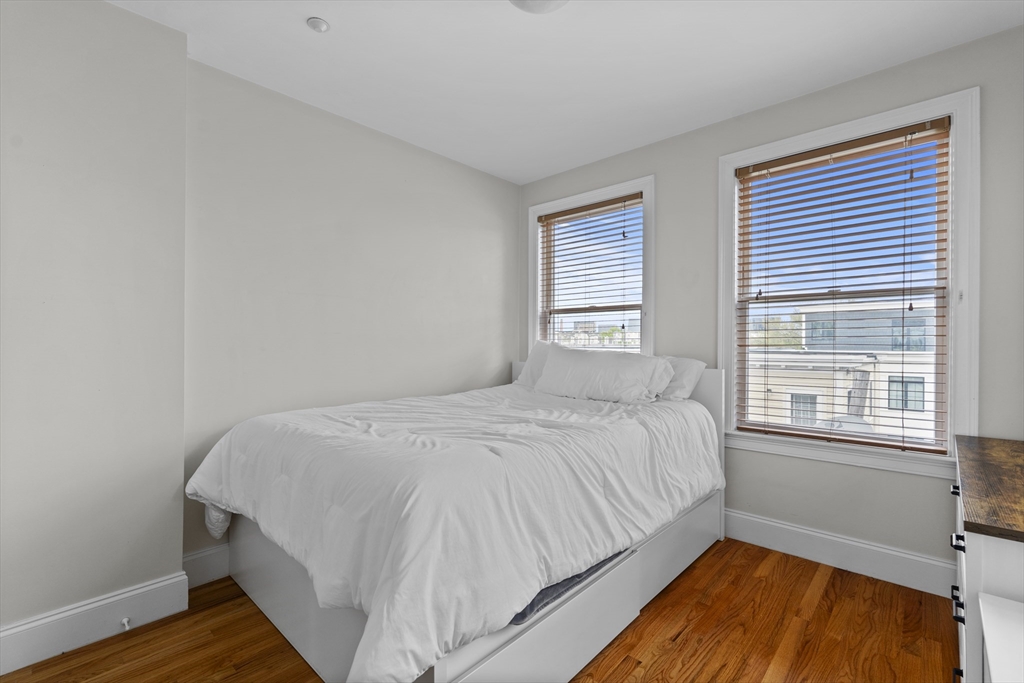 320 West Broadway, Unit 6 Boston, MA 02127 - Photo 9 of 14 a bedroom with bed and window