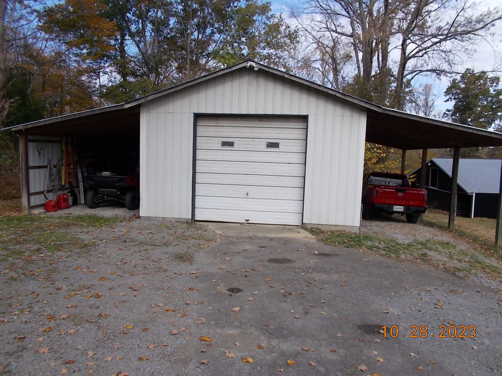 260 Round Top Road Alexandria, TN 37012 - Photo 29 of 65 a view of garage with a car parked and a garage