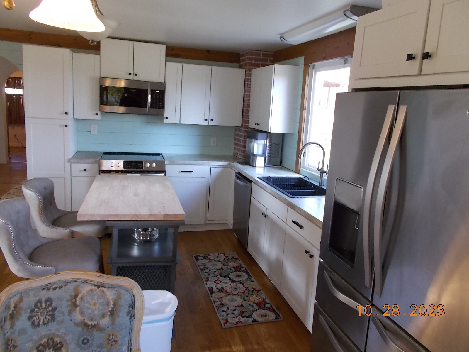 260 Round Top Road Alexandria, TN 37012 - Photo 35 of 65 a kitchen with stainless steel appliances granite countertop a refrigerator stove and sink