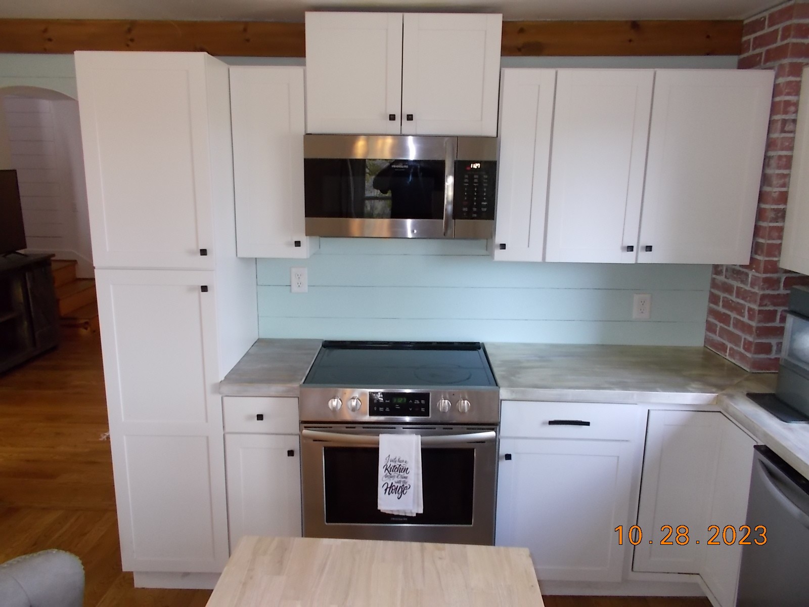 260 Round Top Road Alexandria, TN 37012 - Photo 36 of 65 a kitchen with stainless steel appliances a stove a microwave and a white cabinets