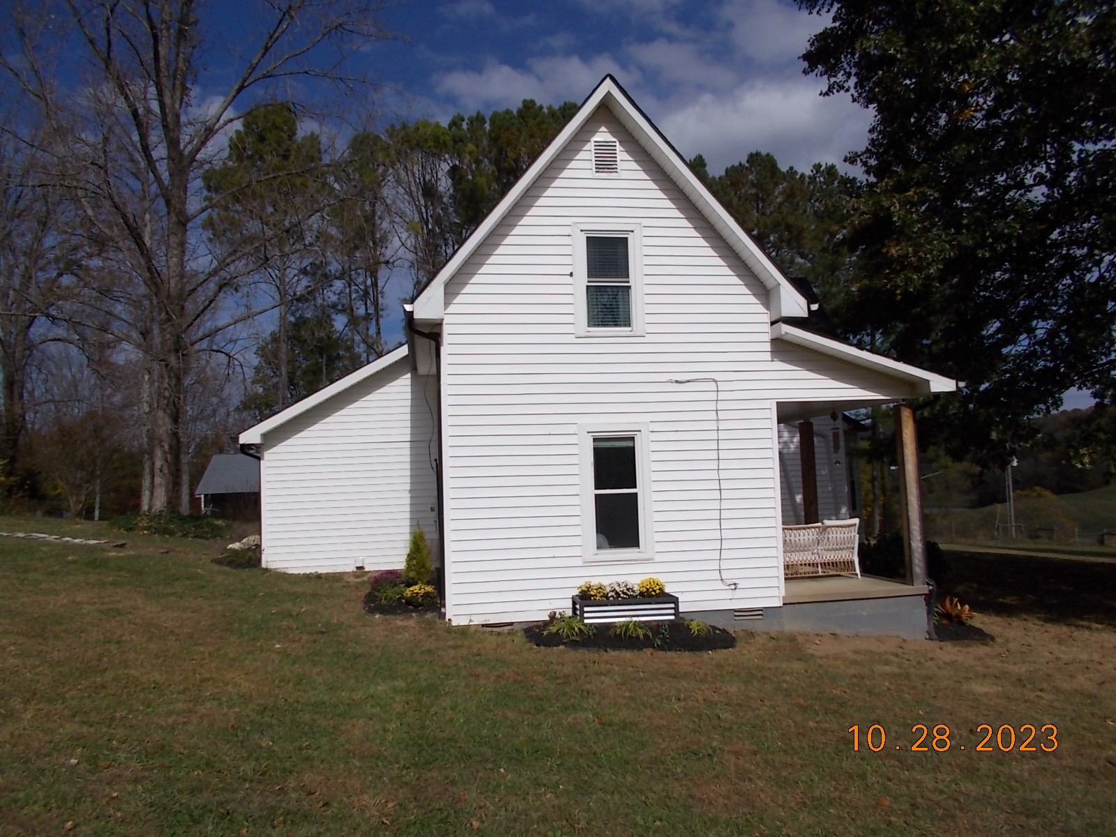 260 Round Top Road Alexandria, TN 37012 - Photo 7 of 65 a view of a white house with a yard