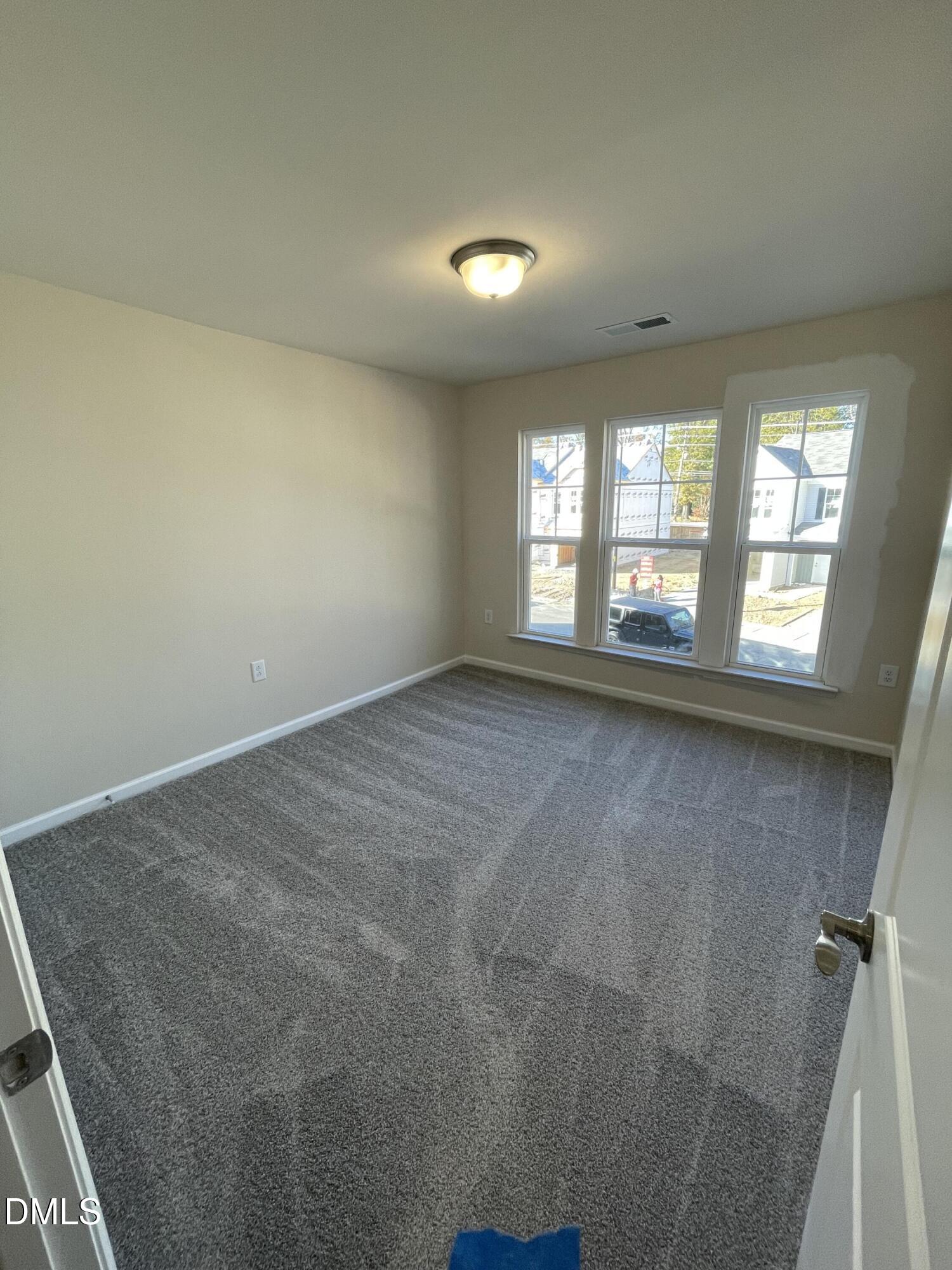 4218 Congleton Place Durham, NC 27703 - Photo 16 of 19 an empty room with windows