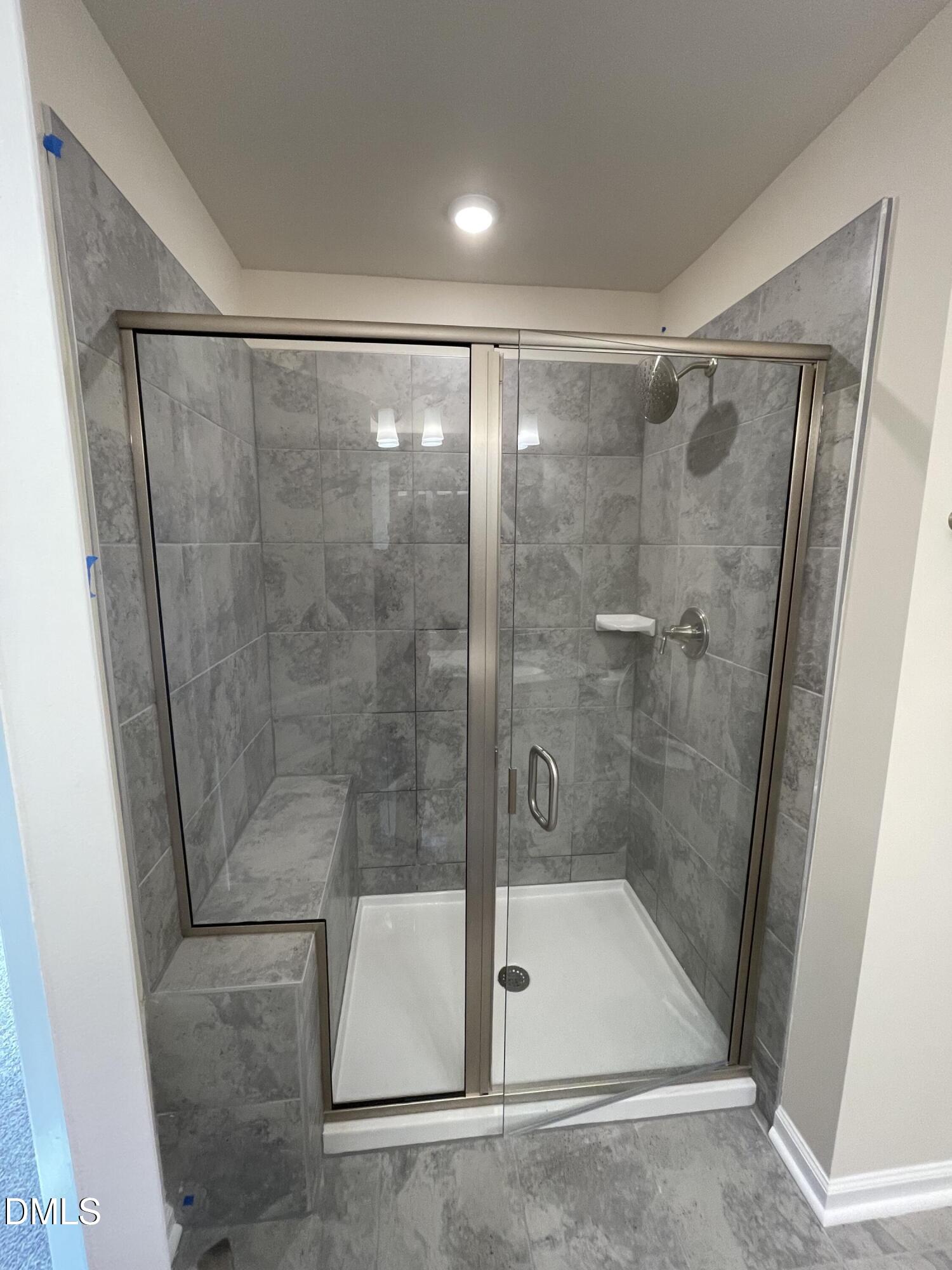 4218 Congleton Place Durham, NC 27703 - Photo 17 of 19 a bathroom with a shower and toilet