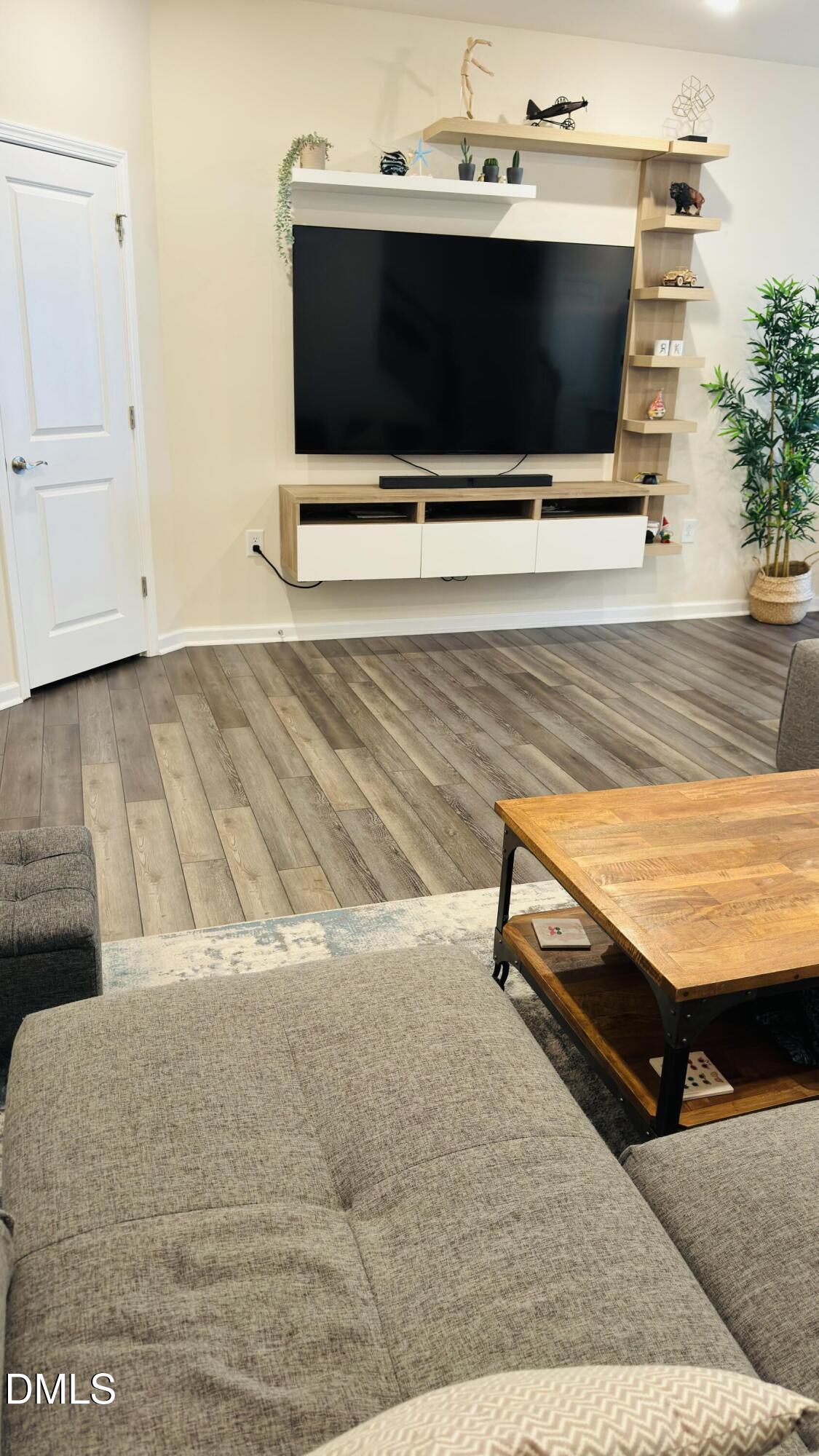 4218 Congleton Place Durham, NC 27703 - Photo 2 of 19 a living room with a flat screen tv and a fireplace