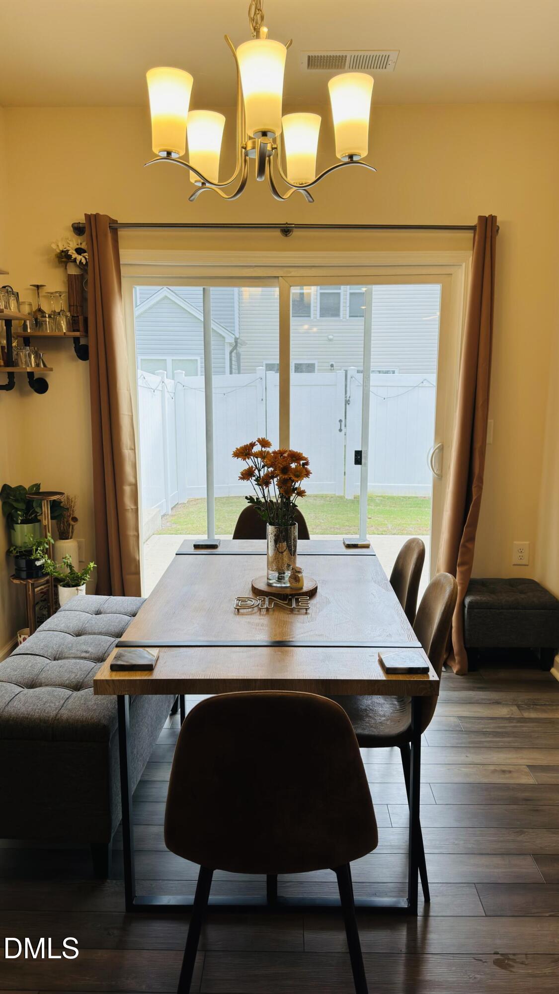 4218 Congleton Place Durham, NC 27703 - Photo 4 of 19 a dining table with chairs and wooden floor